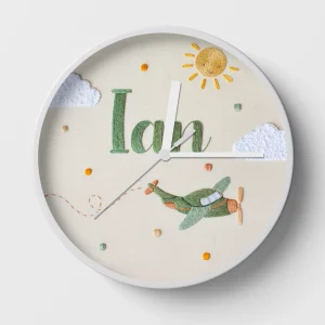Hand-embroidered sky clock with green spiral plane – name embroidery gift