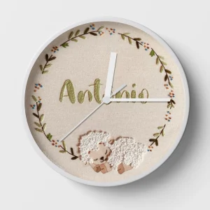 Two lambs personalized wall clocks for a nursery.