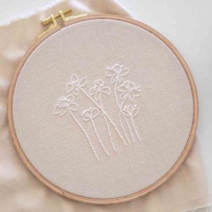 Ethereal Blossoms: Hand-Embroidered White Floral Silhouettes
