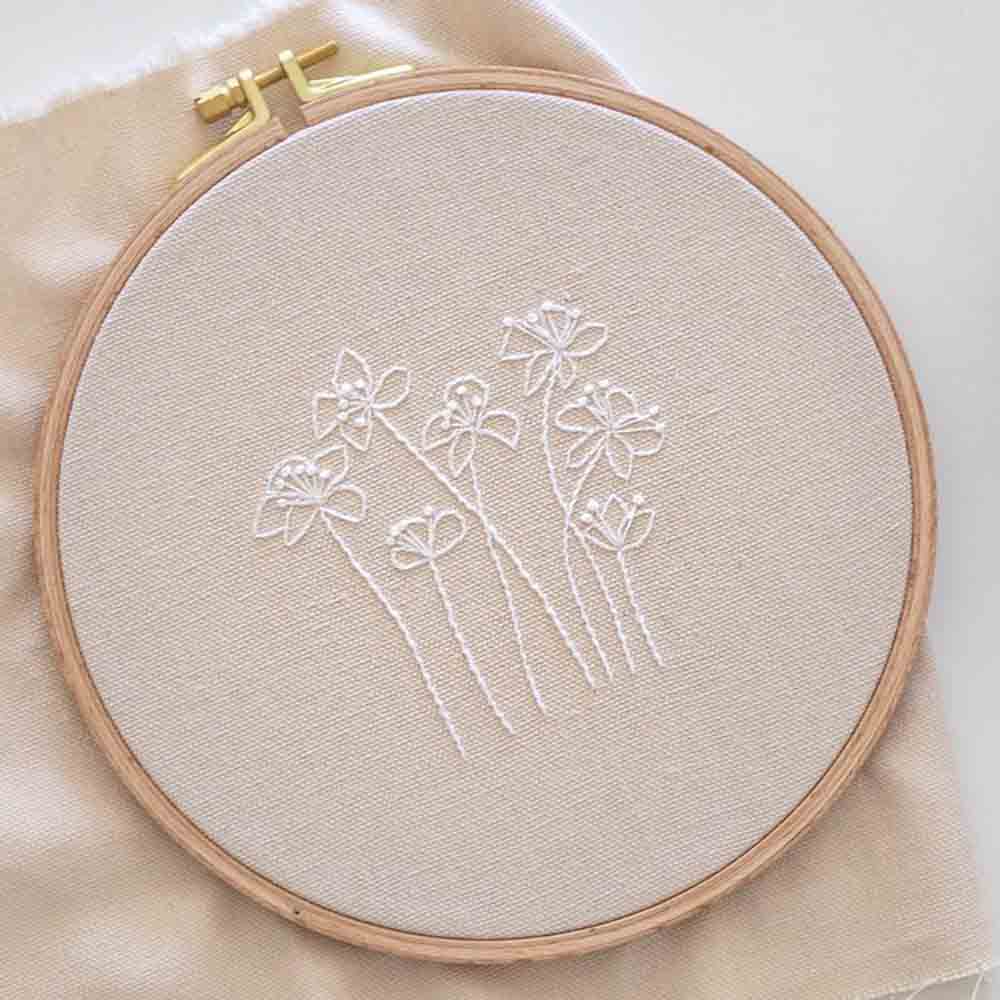 Ethereal Blossoms: Hand-Embroidered White Floral Silhouettes