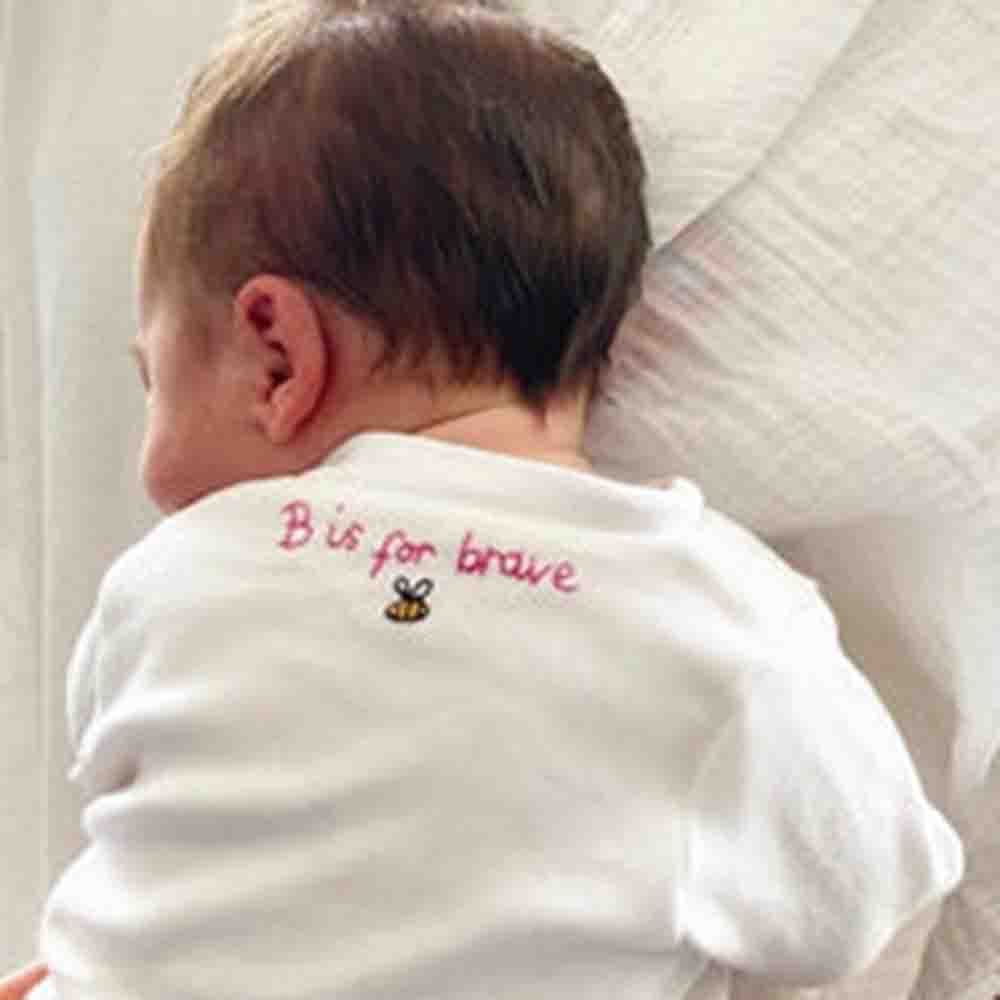 "Pure Bliss" Personalized White Embroidered Baby Onesie 1