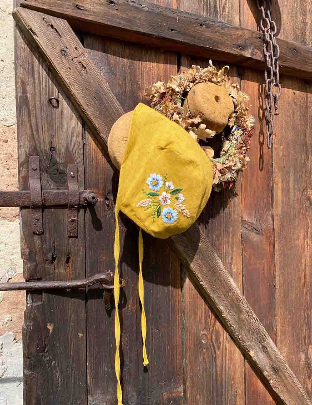 Exquisite Hand Embroidered Linen Baby Bonnet with Botanical Design 4