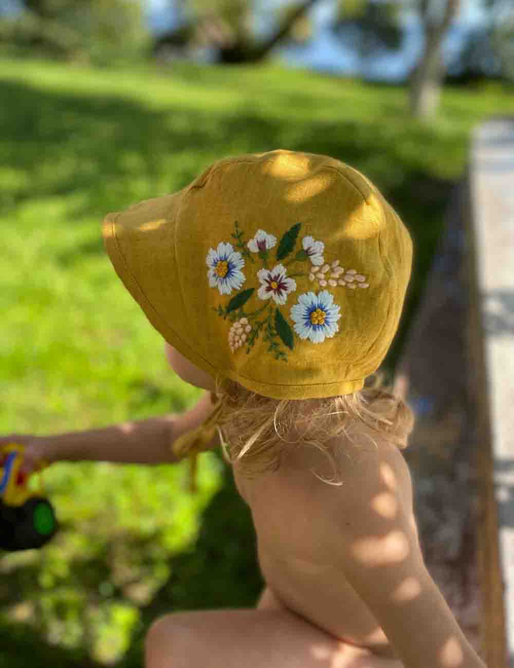 Exquisite Hand Embroidered Linen Baby Bonnet with Botanical Design 1